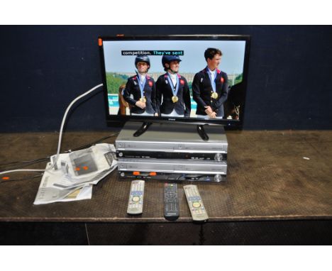A POLAROID 26in TV/DVD WITH REMOTE and manual and two Panasonic DMR-EX95V DVD VHS recorders with remotes (all PAT pass and wo