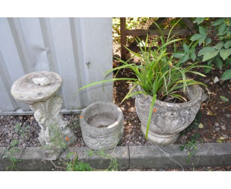 THREE MODERN COMPOSITE GARDEN ITEMS comprising of a large planter with acanthus leaf detail to bowl, a smaller planter and a 