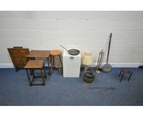 A SELECTION OF OCCASIONAL FURNITURE, to include a white painted wicker basket, two tables from a nest of tables, an oak fire 