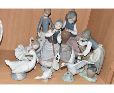 A COLLECTION OF LLADRO AND NAO FIGURES, comprising Lladro: A Clean Sweep, model no 5025, sculptor Julio Fernandez, issued 198