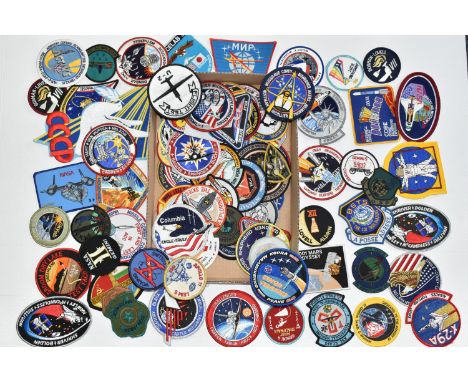A BOX OF MOSTLY AMERICAN SPACE MISSION RELATED CLOTH BADGES, to include crew name badges, Gemini 4 first spacewalk, Mercury 3