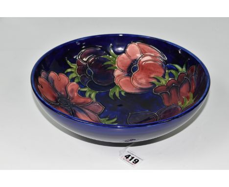 A MOORCROFT POTTERY 'ANEMONE' PATTERN FRUIT BOWL, tube lined with pink and purple anemone flowers on a cobalt blue ground, pa