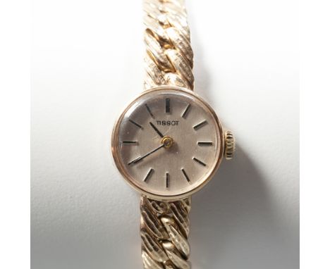 LADY'S NINE CARAT GOLD TISSOT COCKTAIL WATCH
signed manual wind movement, the silvered dial with baton hour markers, hallmark