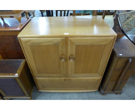 An Ercol Blonde television cabinet