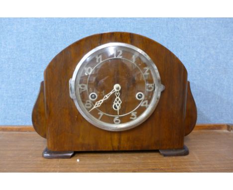 A walnut mantel clock