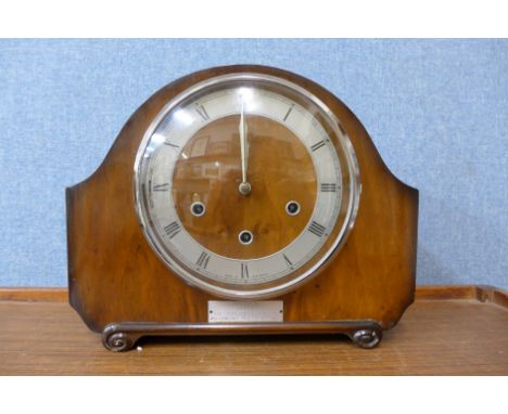 A walnut mantel clock