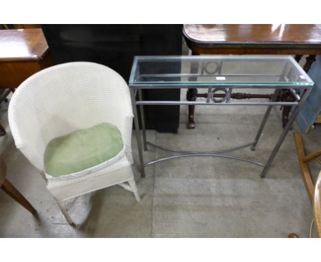 A small console table and wicker chair