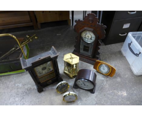 An Enfield Bakelite mantel clock, a brass anniversary clock and five other clocks