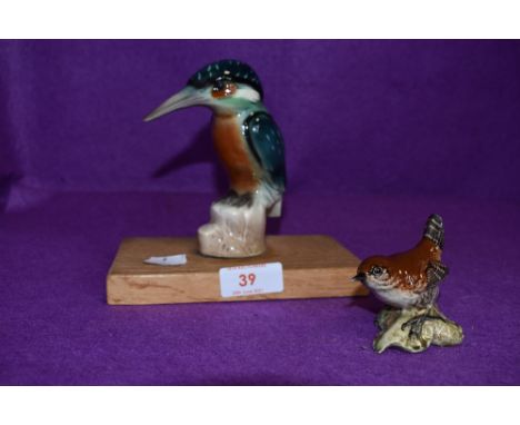 A ceramic figure of a kingfisher hand decorated with a similar Beswick wren