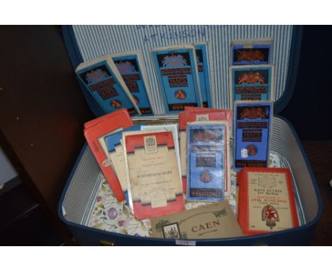A selection of ordnance survey guides and maps including Bartholomews in vintage suitcase