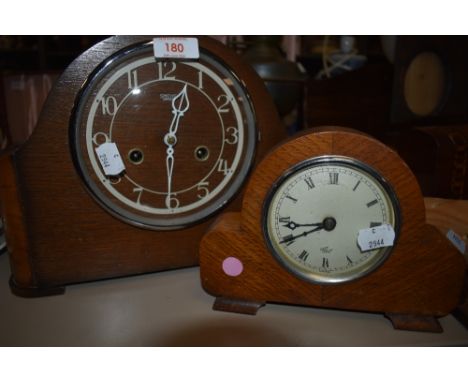 Two vintage wooden mantel clocks, one being Smiths the other an Elliot clock.