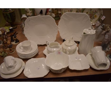 A collection of Shelley dainty white including tea pot,coffee pot,sugar basin and more.