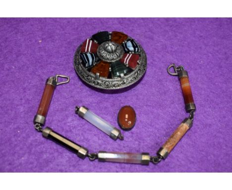 A Scottish hardstone part bracelet having five (plus 1) agate octagonal batons with white metal connector caps and links, no 