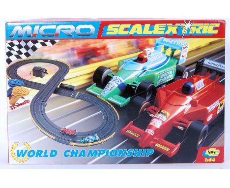 An original Micro Scalextric set with 2x F1 style racing cars G.094. 1:64 scale with 2.62 meter track. Appears complete &amp;