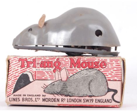 An original vintage Tri-ang Minic clockwork mouse. No key. Within original box.&nbsp;

POSTAGE: Worldwide Postage &amp; Packi