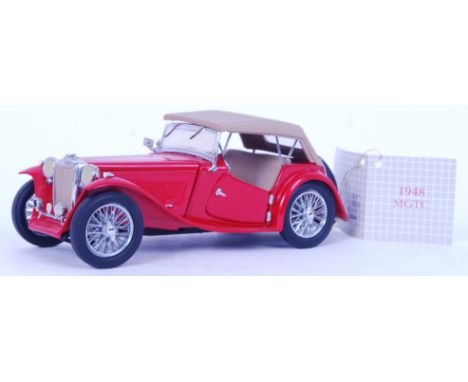 An original Franklin Mint 1948 red MGTC roaster. Includes partial original packaging

POSTAGE: Worldwide Postage &amp; Packin