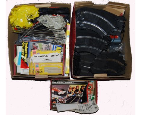 A large collection of 2x boxes of loose Scalextric accessories to include; tracks and Faller racing kits 4580, 4120 etc. Trac