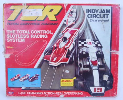 An original 1970's TCR Total Control Indy Jam Racing system by Ideal Toys 1636-0. 17 feet track. Contains 3x cars and appears