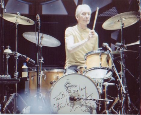 Rolling Stones - Charlie Watts. A dedicated 10x8 picture of Watts behind the drums. Excellent.  Good condition. All signed it