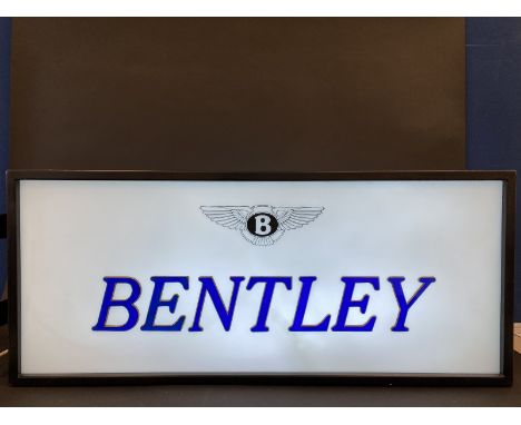 A showroom lightbox for Rolls-Royce and Bentley, the perspex panels having blue and gilded plastic letters, age unknown, in w
