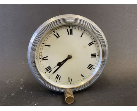 A Jaeger style eight day car clock, dial not marked, bottom wind. 