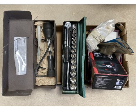 A box of tools including a boxed regulator, an air cutter, a socket set etc.
