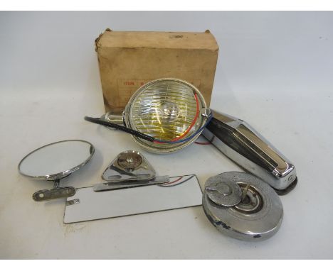 A small selection of chrome pieces including a boxed fog lamp, petrol filler cap etc. 
