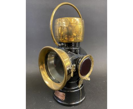 A Lucas 'King of the Road' No. 632 side lamp, black enamelled finish with polished brass and red glass side lens. 