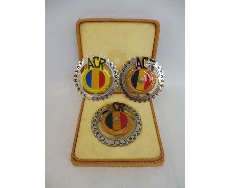 Three Romania automobile club badges, one in original box of issue. 