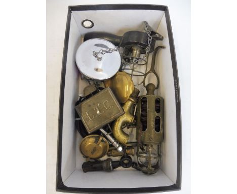 A small box of interesting items including a hanging inspection lamp. brass tap etc.