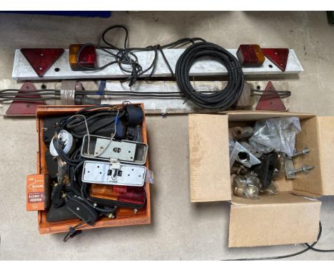 Two boxes of trailer equipment and two lighting boards.
