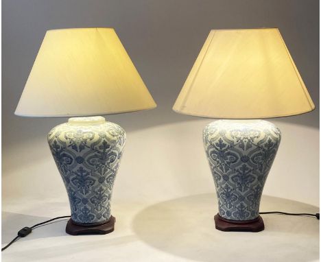 TABLE LAMPS, a pair, Chinese blue and white ceramic, of vase form with cream shades, 73cm H. (2) 