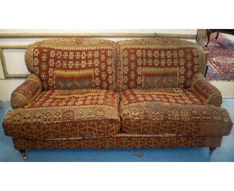 KILIM SOFA, 186cm x 94cm, three seater with turned feet and brass castors. 