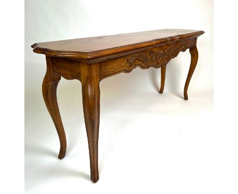 CONSOLE TABLE, French provincial style fruit wood, the shaped top above a carved frieze on cabriole legs, 66cm H x 151cm x 38