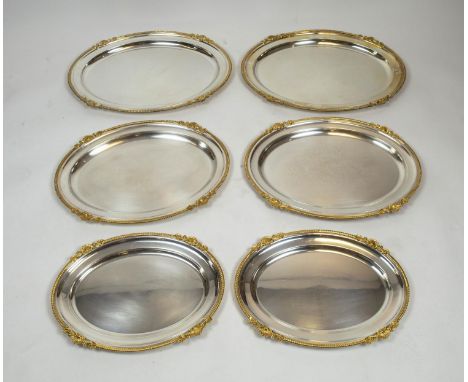 SERVING TRAYS, Garrard and Co, regent silver plate, three pairs, oval with gilt scallop shell edge. 62cm L x 46cm  W. 