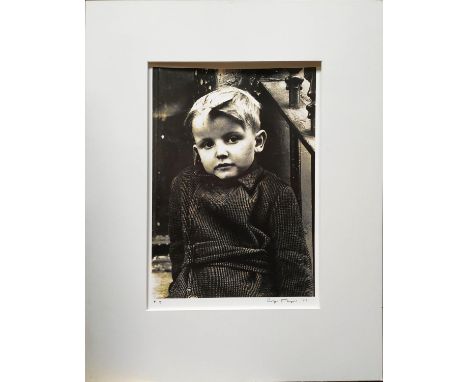 ROGER MAYNE (British, b.1929) 'Boy, St. Stephen's Gardens', gelatin silver print, signed, 35cm x 25cm, framed. (Subject to AR