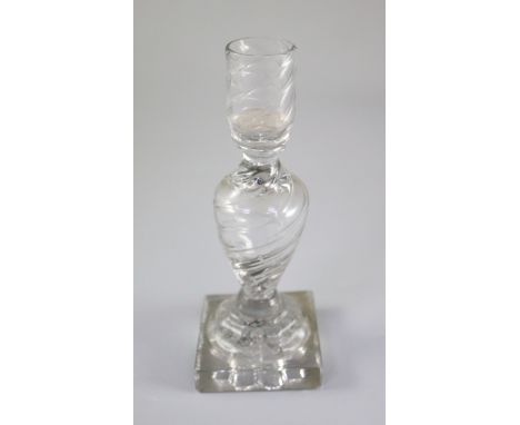 A George III rib moulded glass candlestick, third quarter 18th century, with hollow stem and 'lemon squeezer' base, 19.5cm hi