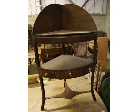 A George III mahogany bow front three tier washstand, width 58cm, depth 40cm, height 108cm