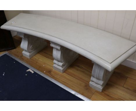 A reconstituted marble concave garden bench, width 150cm height 46cmCONDITION: Top looks to have been painted and varnished o