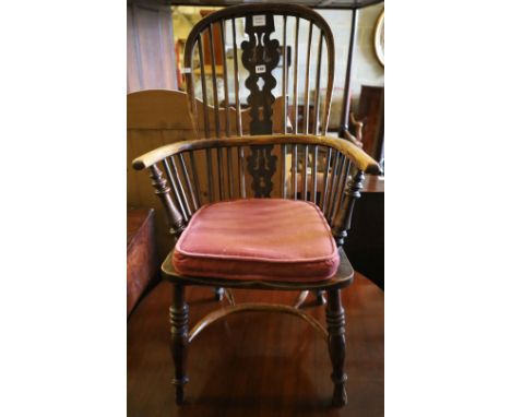 A 19th century Windsor elm and ash stick back elbow chair