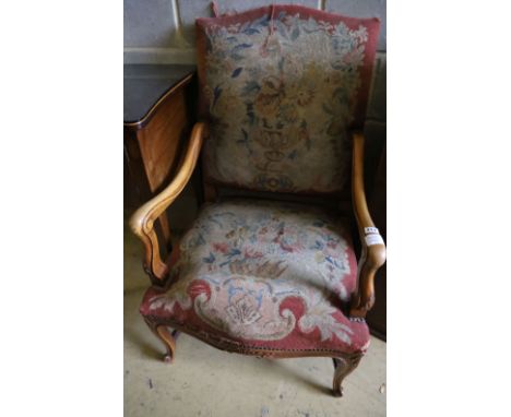 A Louis XIV style tapestry upholstered walnut framed fauteuil, width 62cm height 102cm