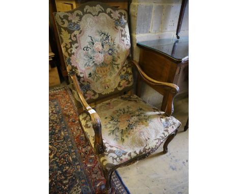A Louis XVI style tapestry upholstered walnut fauteuil, width 85cm height 116cm
