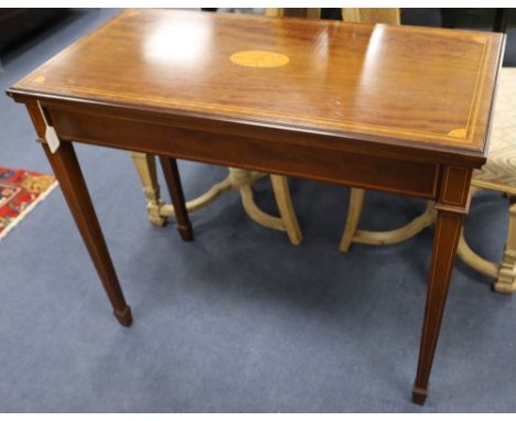 An Edwardian inlaid mahogany folding top card table, width 92cm depth 46cm height 76cm