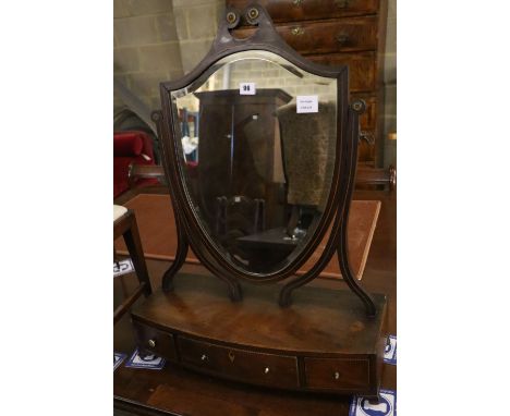 A George III mahogany toilet mirror with bow front box base, width 55cm, depth 22cm, height 72cm