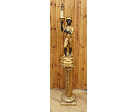 A French composition Blackamoor table lamp on column