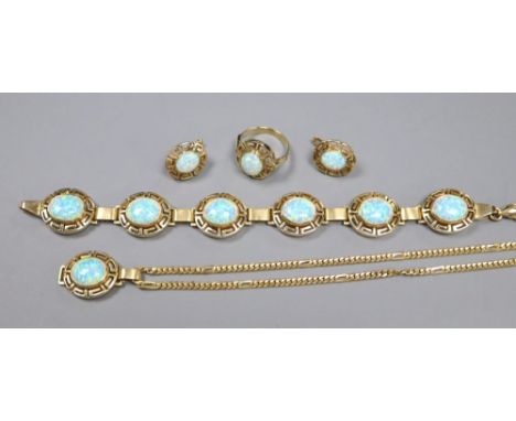 A suite of Indian 585 and white opal jewellery retailed by Alnur, with Greek Key pattern mounts, comprising a bracelet formed