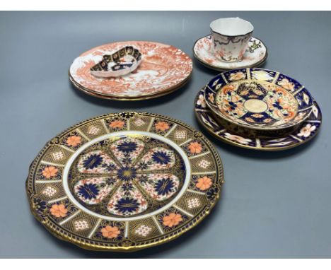 Two Royal Crown Derby Imari pattern plates, three Crown Derby plates or saucers, a Royal Crown Derby cup and two saucers and 