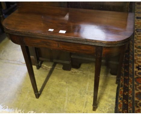 A George III mahogany folding card table, width 95cm depth 45cm height 74cm