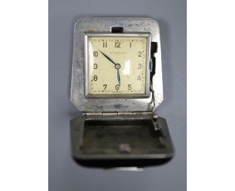 A Swiss stainless steel and black enamel Eterna travelling watch, 4cm.CONDITION: Interior metal work some wear and minor corr