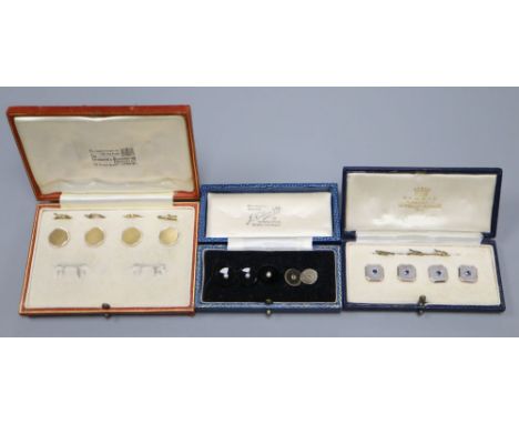 Two cased sets of four 18ct and Plat buttons, one set with sapphires and five other buttons, 18ct and plat gross 17.7 grams.C